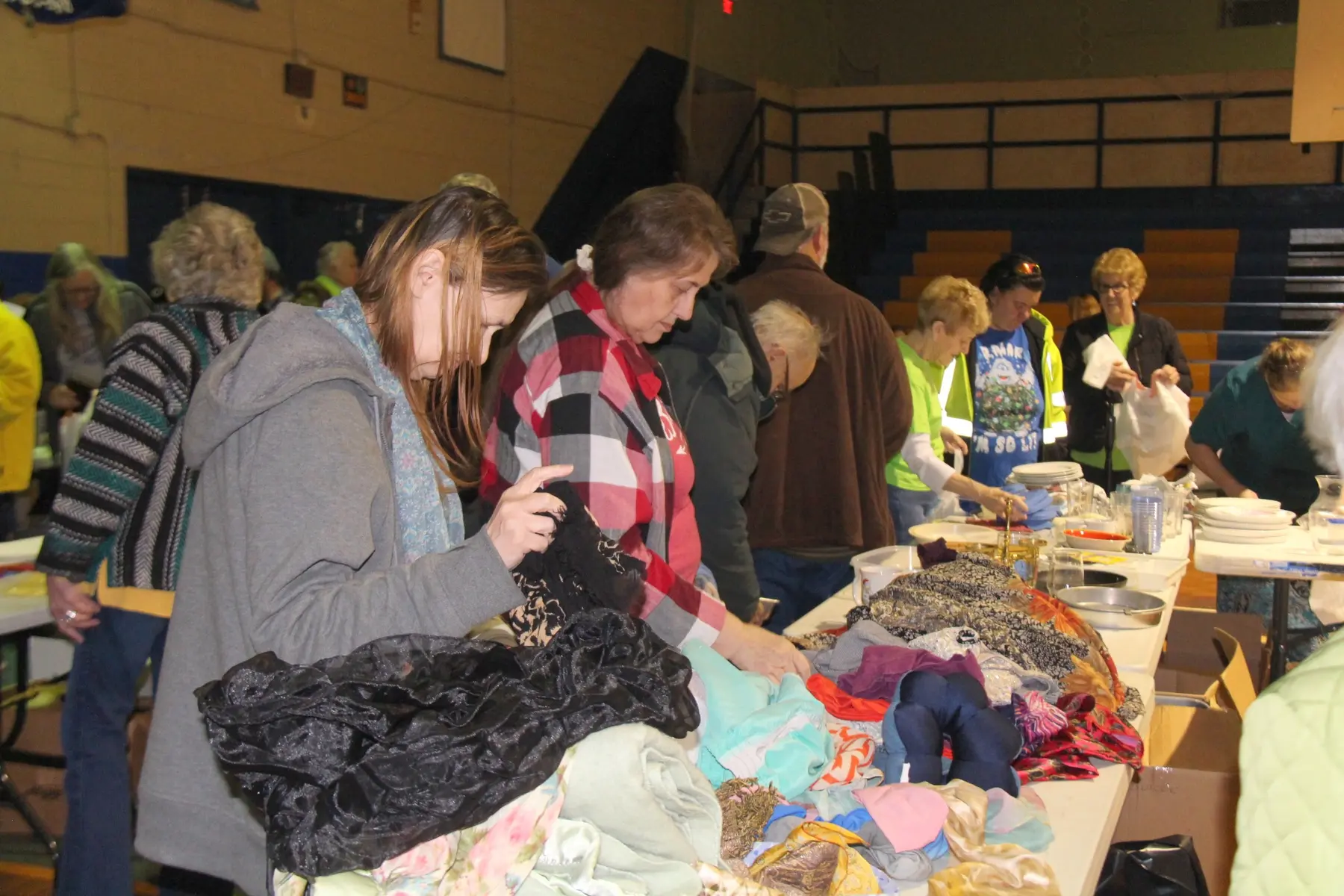 A family looking through clothing