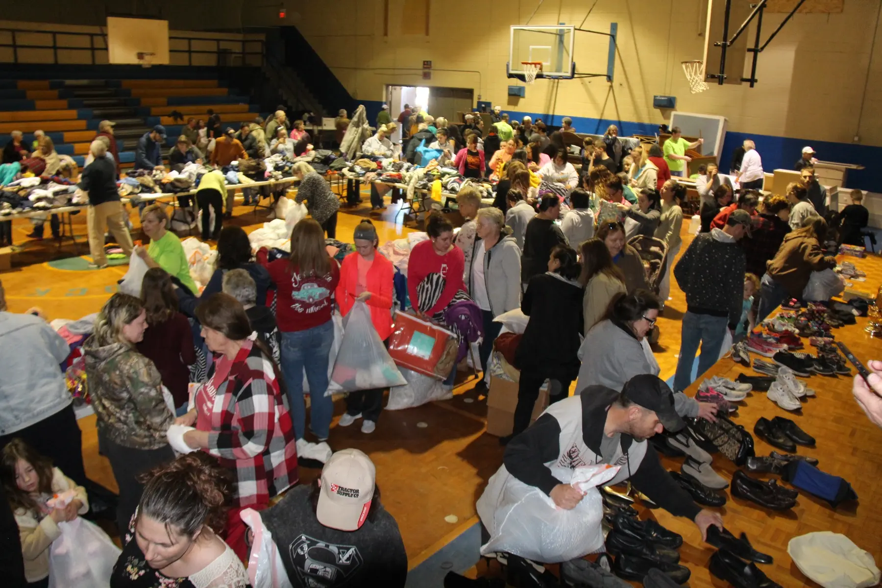 A large community clothing distribution in a gym