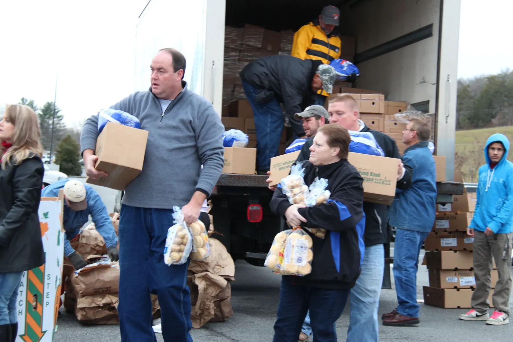 Volunteers unloading food for distribution