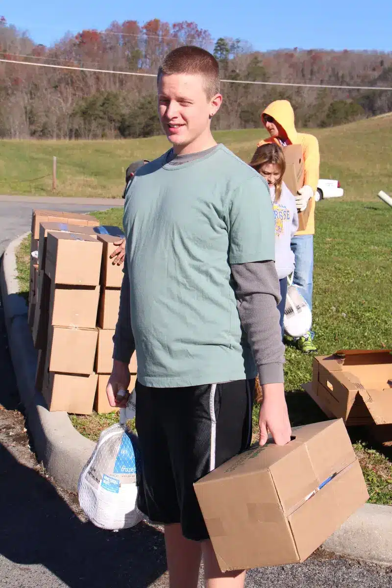 A volunteer helping with food distribution